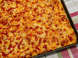 Medium-thin, crispy crust topped with sauce, cheese, and more sauce Medium-thin, crispy crust topped with sauce, cheese, and more sauce